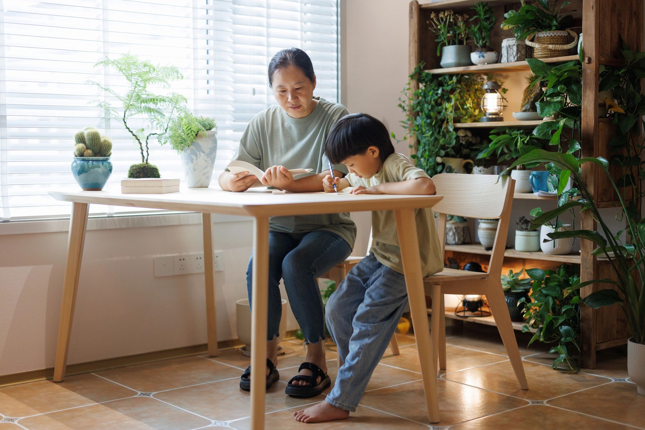 Parent helping child with homework at home