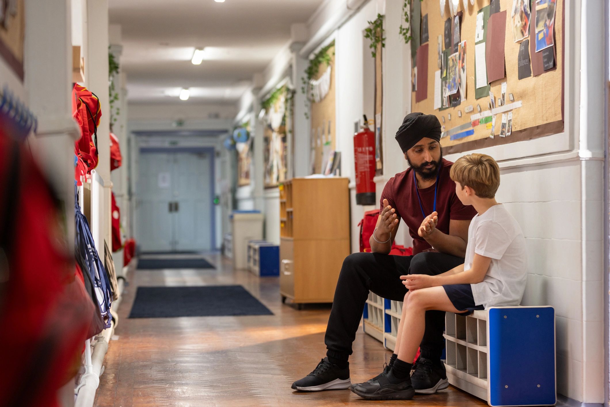 Teacher supporting a student at school