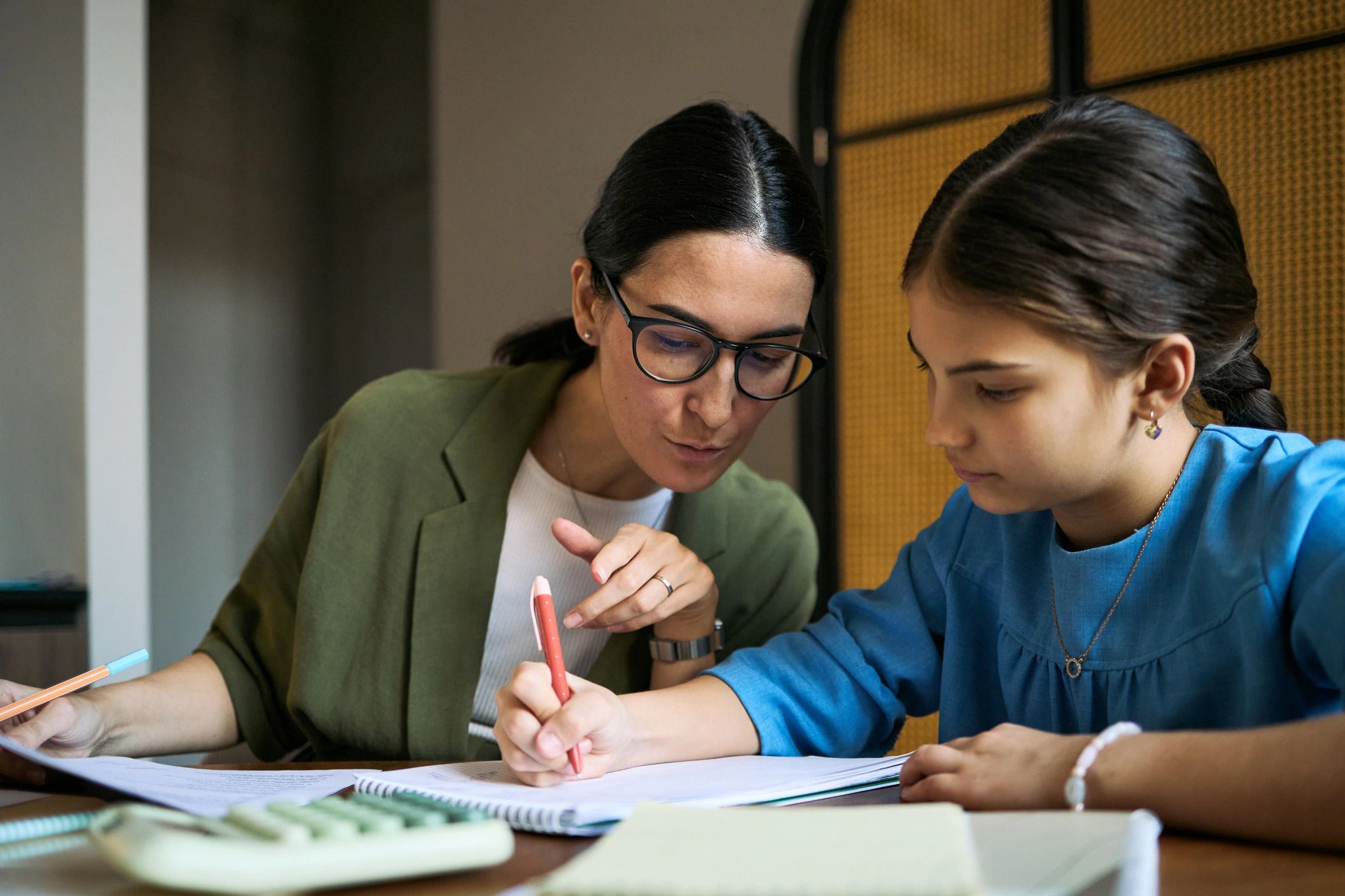 Tutor helping a student during a learning session